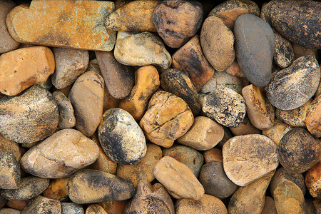 一堆圆形鹅卵石卵石石头墙纸材料岩石背景图片