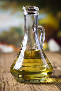 外维尔京利橄榄油 地中海农村主题瓶子叶子食物玻璃香蒜烹饪液体香料美食蔬菜背景图片