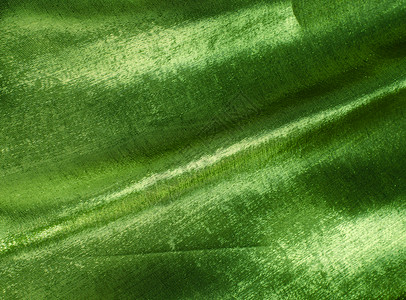 绿色丝织丝绸织物布料材料金子奢华背景图片