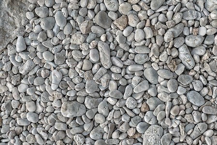 以岩石为背景卵石灰色花园圆形海滨墙纸石头海岸鹅卵石公园背景图片