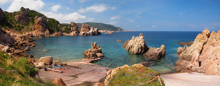 撒丁岛的岩石海岸红色风景海滩崎岖全景天堂背景