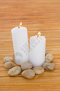 带有石块的蜡烛背景图片