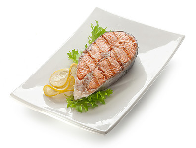 混血鲑鱼的赌注剥离食物绿色鳟鱼黄色油炸盘子白色柠檬海鲜背景图片