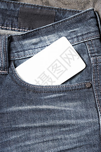 吉安口袋名牌织物裤子棉布商业卡片蓝色帆布材料衣服牛仔裤背景图片