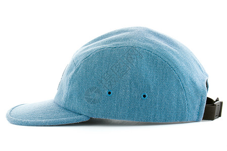 蓝帽子黑帮蓝色棉布帽子头盔衣服纺织品广告帆布商品背景图片