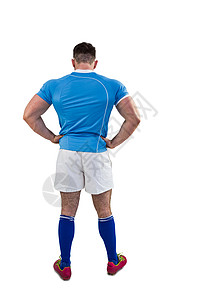 手放在臀部的橄榄球运动员运动服男性男人体育竞技蓝色双手肌肉服装运动背景图片