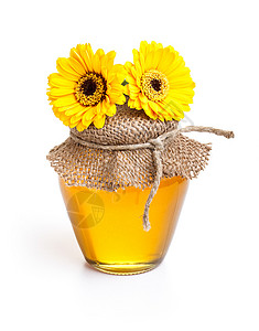 黄色蜂蜜液体蜂蜜罐花蜜玻璃蜂蜜食物金子液体乡村黄色白色营养背景