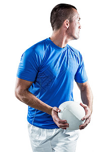 橄榄球玩家一边拿球一边往远方看力量服装男性男人运动员挑战专注蓝色活动运动背景图片