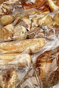 储存在纤维素袋中的面包和饼干背景图片