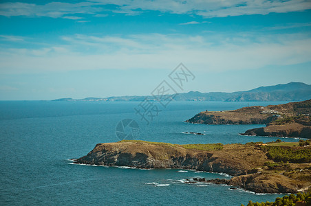 海波浪太阳蓝色海滩旅行岩石假期天空背景图片