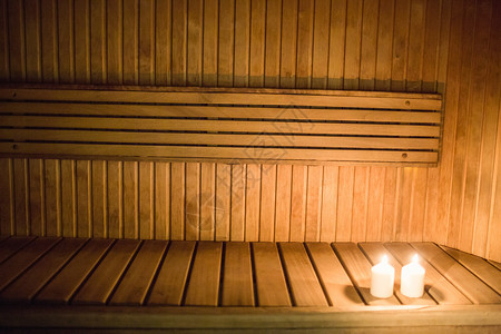 在桑浴间照明的蜡烛桑拿疗法中心水疗酒店身体闲暇护理背景图片