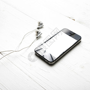 带耳机的手机互联网电话音乐电缆音乐播放器玩家展示耳塞娱乐电子背景图片
