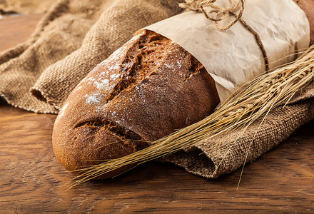 纸上包着的面包面包面粉高清图片素材