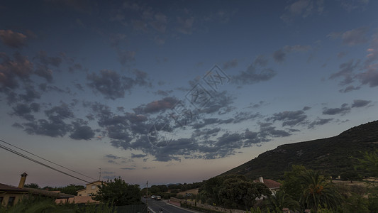 罗马语 Romagordo蓝色天空牧场太阳树木日落背景图片