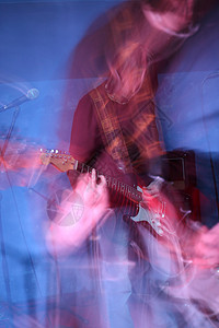 吉他手在舞台上音乐演员噪音岩石活力重金属手指吉他电吉他情感背景图片