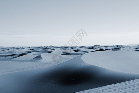 摩洛哥的撒哈拉沙漠橙子沙丘蓝色旅行地形口渴日落沙漠旅游太阳背景图片