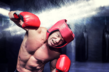 黑色背景下攻击性拳击手的复合图像闲暇沙袋健美运动员运动主义娱乐器材拳头体质背景图片