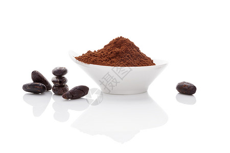 可可豆和可可粉甜点粉末烹饪食物地面豆子美食反射巧克力可可背景图片