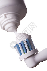 紧贴电动牙刷和白纸糊产品牙科牙列广告预防牙膏家庭用品卫生清洁度背景图片