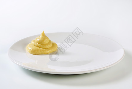 芥辣酱调味品敷料白色美味食物盘子漩涡背景图片