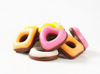 糖果基金会黄色软糖白色食物涂层甜点橙子粉色巧克力背景图片