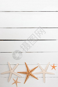 白木上的海星橙子白色风格工作室海洋装饰木头框架星星背景图片