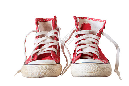 白色孤立的旧运动鞋背景图片