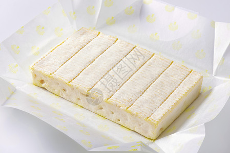 乳酪 薄白皮奶制品霉菌白色包装纸矩形砖块食物背景图片