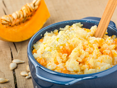 加南瓜闭合的米粉粥食物饮食橙子生长谷物美食葫芦早餐午餐勺子木头高清图片素材