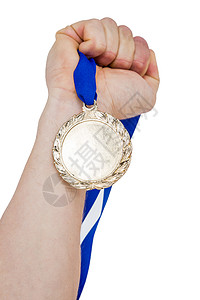 握着奥运金牌的手贴近游戏荣誉奖牌优胜者成就胜利金属竞赛国家奖章背景