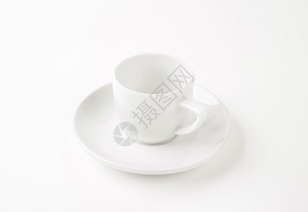 白杯和茶盘飞碟咖啡杯餐具白色瓷器盘子背景图片