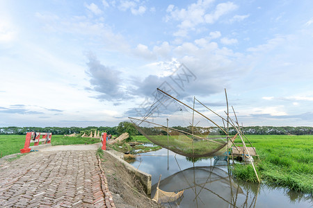 鱼网和渔民渔夫竹子钓鱼背景图片