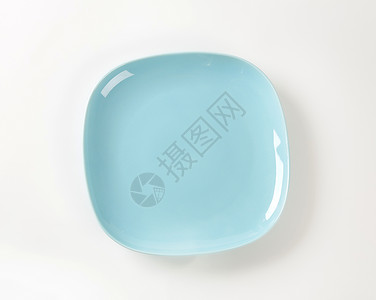 浅蓝蓝色平板陶器餐具正方形盘子陶瓷制品浅蓝色点心盘背景图片