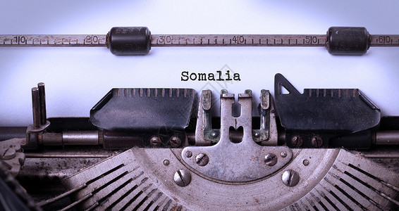 旧打字机     索马里乡愁记者备忘录笔记刻字作家金属机器白色技术背景图片