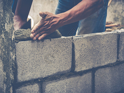 砖砖建工是建筑墙壁建筑学石匠石工工人石头男人房子水泥建设者瓦工背景图片