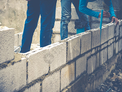 砖砖建工是建筑墙壁工匠砖块石头水泥瓦工工作房子石工石匠建筑学背景图片