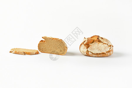 新鲜的结壳面包工匠面包棒圆形食物硬皮横截面背景图片