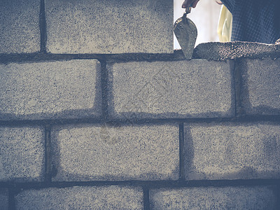 砖砖建工是建筑墙壁瓦工工匠石头工人石工水泥砖块建设者男人石匠背景图片