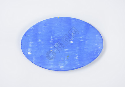 骨切削板用具蓝色炊具高架菜板椭圆形厨房木板背景图片