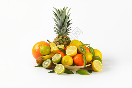 热带水果类种情调异国团体叶子香蕉黄色盘子绿色柠檬橙子背景图片