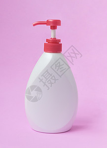 粉色瓶子粉红背景上的白润色瓶子 美容护肤概念身体奶油粉色空白商业头发卫生发胶白色肥皂背景