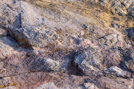 彩色整色尖锐的石质纹理水平棕色黄色裂缝力量侧光岩石大理石地面灰色背景图片