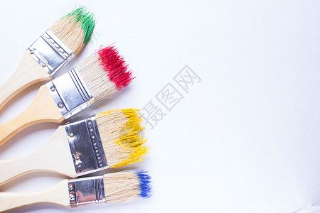 彩色涂料中的油漆笔刷家务装修墙纸刷子液体染料公寓装潢师染色小样背景图片