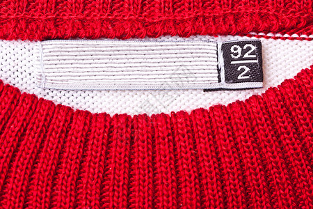 服装标签毛衣材料销售白色规格测量尺寸衬衫红色织物背景图片