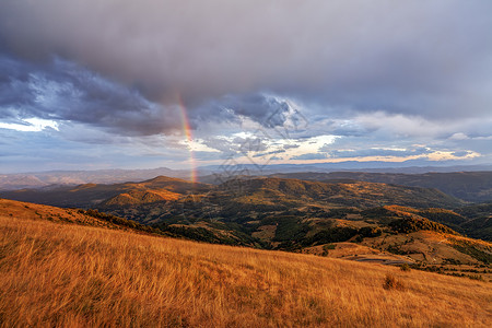 山区风景彩虹国家阳光岩石色彩草地季节橙子爬坡太阳天空国家的高清图片素材