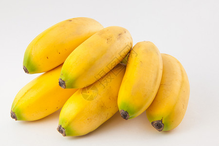 利特尔托波亚小型香蕉 在白面包上称为杂草芭蕉饮食甜点维生素果汁白色热带黄色水果背景