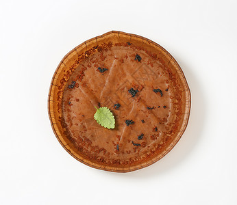 圆纸蛋糕锅蛋糕盘盘子棕色包装高架托盘圆形食物背景图片