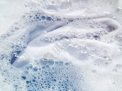 肥皂气泡洗衣服前先抹布 白布织物洗衣店洗涤剂机器身体粉末搪瓷洗澡浴缸肥皂背景