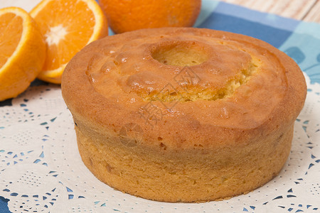 土制橙色蛋糕烹饪食物面粉橙子诱惑面包蓝色圆形美食水果推介会高清图片素材