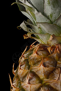 背景上的菠萝提取黑色叶子小吃工作室摄影食物热带黄色气候美食背景图片